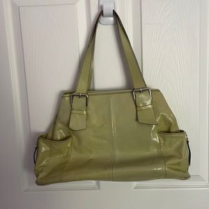 Kenneth Cole green leather lined with brown inside